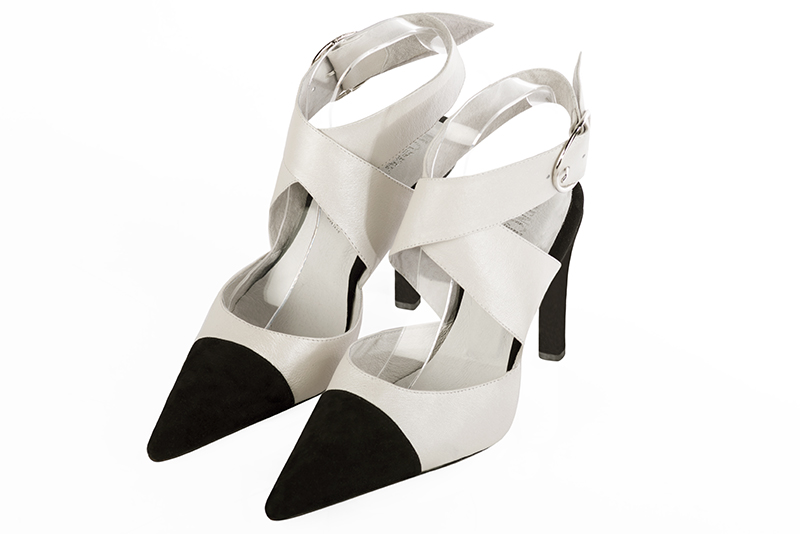 Matt black and off white women's open back shoes, with crossed straps. Pointed toe. Very high slim heel. Front view - Florence KOOIJMAN